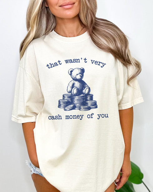 Model wearing ivory color shirt with 'That Wasn't Very Cash Money Of You' graphic design